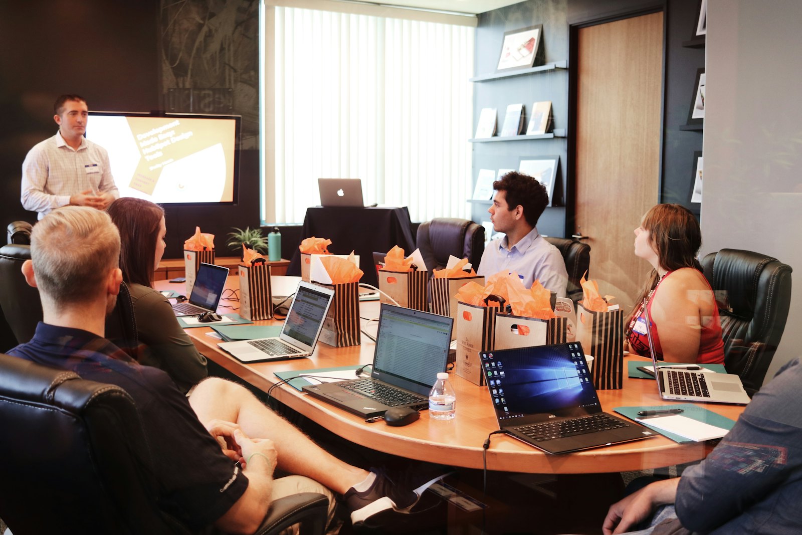 Consultants reviewing an IT strategy on a whiteboard